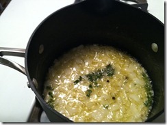 Adding layers of flavor with onion, thyme, and peppercorns.