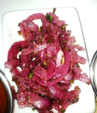 The sumac onion salad is a perfect floral-tart counterpoint to the spicy lamb. 